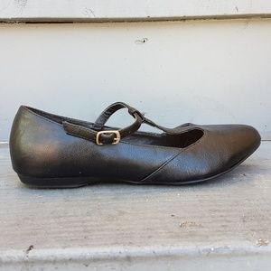 Vegan leather black Mary Jane flats.